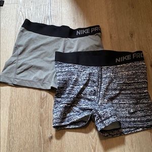 Two pairs of Nike Pros